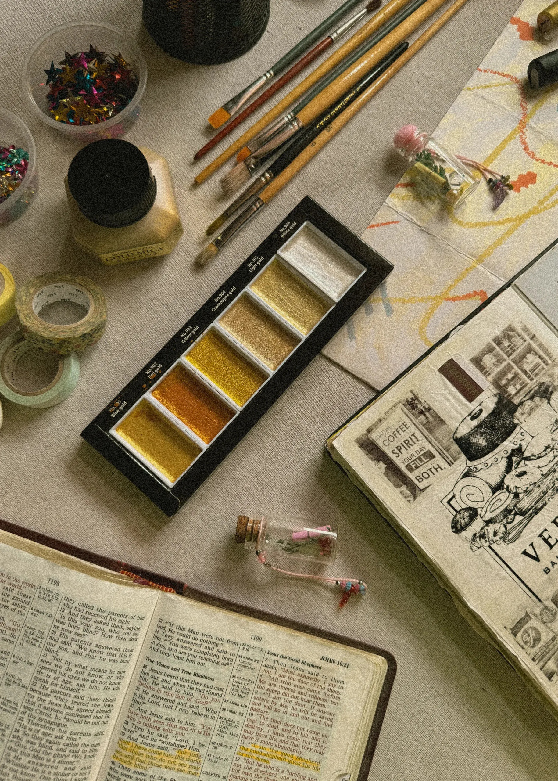 Christian Bible with sketchbook, watercolor paints
